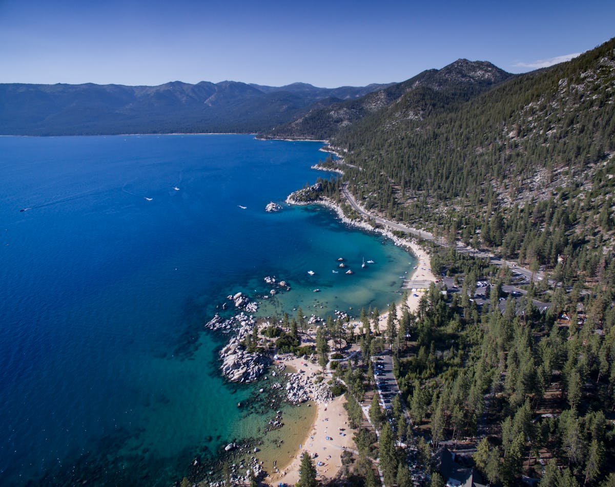 A breathtaking aerial view of Lake Tahoe's stunning coastal landscape with clear blue waters.